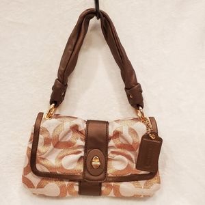 Coach handbag with metallic "C" pattern